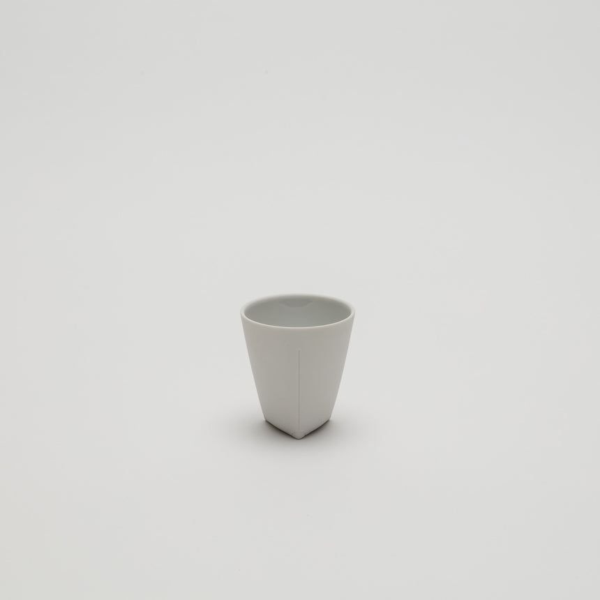 White porcelain espresso cup designed by Christian Haas for Arita 2016. Handmade in Japan. Unglazed exterior, glazed interior in multiple colours. Contemporary ceramics, thin profile.
