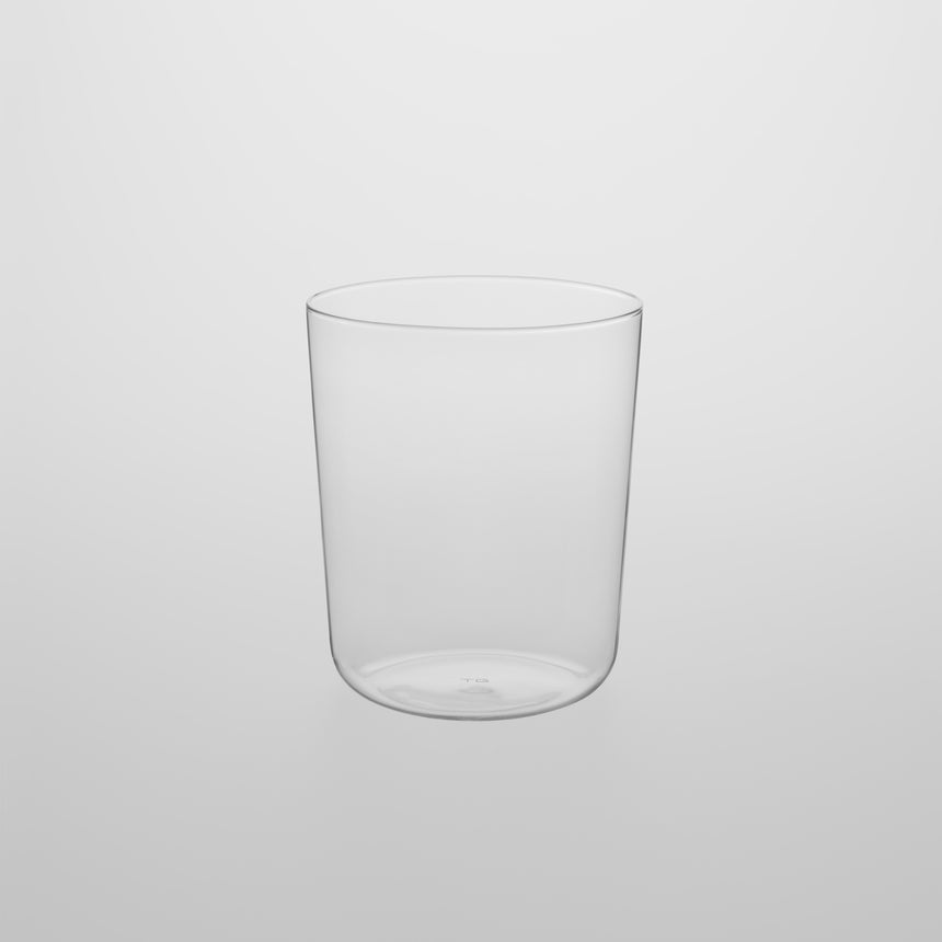 Medium, thin walled glass Designed by Naoto Fukasawa for TG Taiwan Glass. Clear borosilicate on grey background.