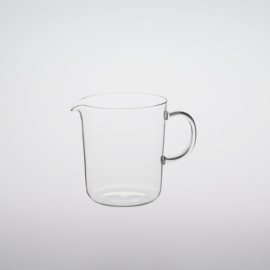 Lipped glass mug lipped glass server design by Naoto Fukasawa borosilicate glass on grey background