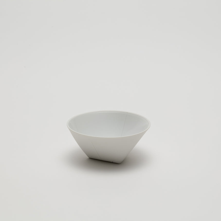 Small porcelain serving bowl designed by Christian Haas for Arita 2016. Contemporary ceramic with triangular base and circular lip. Matte exterior, glossy glazed interior with thin walls.