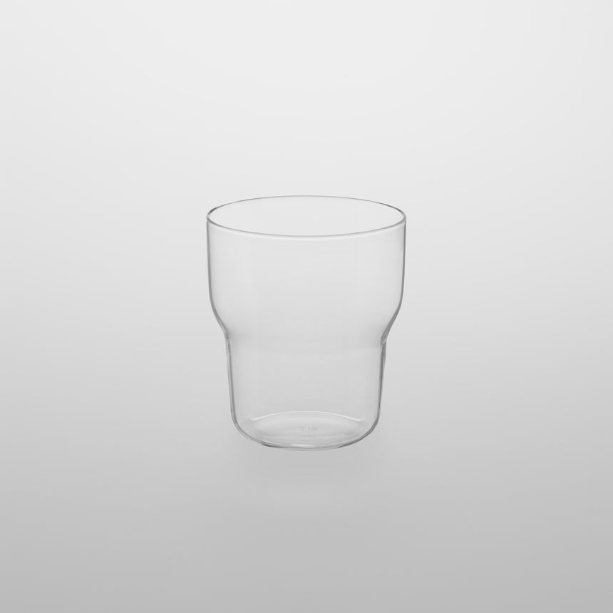 Stackable glass tumbler Designed by Naoto Fukasawa for TG Taiwan Glass. Clear borosilicate on grey background.