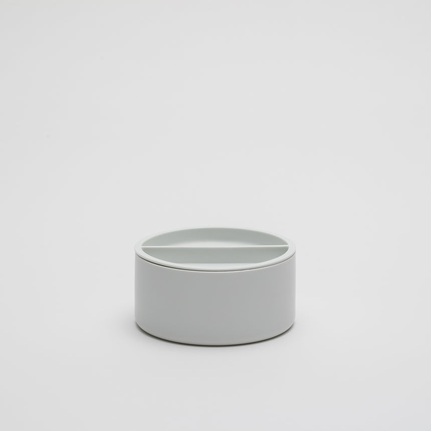 Wide, short porcelain container designed by Shigeki Fujishiro for Arita 2016. Handmade in Japan. Contemporary ceramic with fitted lid, unglazed exterior, matte finish.