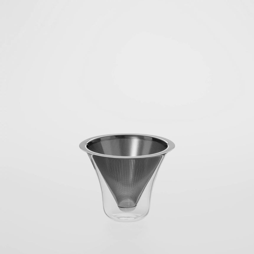A stainless steel coffee filter in a glass cup Toronto Coffee Shop