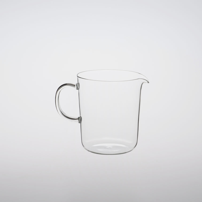 Lipped glass mug lipped glass server design by Naoto Fukasawa borosilicate glass on grey background